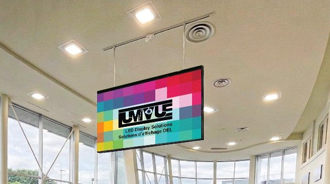 Double-sided LED display hung from a showroom ceiling